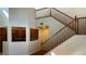 View of wooden staircase with access to kitchen at 11404 Belmont Lake Dr # 103, Las Vegas, NV 89135