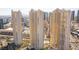 Aerial view of modern high-rise buildings featuring a pool and lush landscaping at 125 E Harmon Ave # 2218, Las Vegas, NV 89109