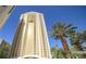 High-rise building with many windows, towering palm trees and clear blue skies at 125 E Harmon Ave # 2218, Las Vegas, NV 89109