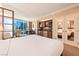 This is a well lit main bedroom, with a large bed and attached kitchenette at 125 E Harmon Ave # 2218, Las Vegas, NV 89109