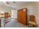 Bedroom featuring a wardrobe, a small table, two chairs, and carpeted flooring at 1904 Fontenelle St, Las Vegas, NV 89102