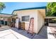 Exterior view of the home featuring ample parking space, a side patio, and a neutral color palette at 1904 Fontenelle St, Las Vegas, NV 89102