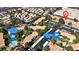 Community aerial view with multiple community pools, covered parking, and lush greenery at 220 Mission Catalina Ln # 208, Las Vegas, NV 89107