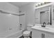 Well-maintained bathroom with white tile, updated fixtures, and modern vanity at 220 Mission Catalina Ln # 208, Las Vegas, NV 89107
