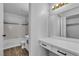 Bright bathroom with neutral walls, tile flooring, and vanity area at 220 Mission Catalina Ln # 208, Las Vegas, NV 89107