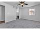 Bright bedroom with neutral decor, ceiling fan, and walk-in closet is move-in ready at 220 Mission Catalina Ln # 208, Las Vegas, NV 89107