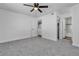 A neutral-toned bedroom offers ceiling fan, and entrances to the bathroom and walk-in closet at 220 Mission Catalina Ln # 208, Las Vegas, NV 89107