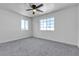 Sunny bedroom features neutral walls, carpet, and ceiling fan for added comfort at 220 Mission Catalina Ln # 208, Las Vegas, NV 89107