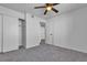 Neutral bedroom features ceiling fan, closet, carpet, and white walls at 220 Mission Catalina Ln # 208, Las Vegas, NV 89107