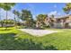 Expansive green common area perfect for outdoor activities, featuring mature trees and lush lawns at 220 Mission Catalina Ln # 208, Las Vegas, NV 89107