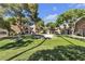 Serene common area with mature trees providing ample shade, enhancing the community's appeal at 220 Mission Catalina Ln # 208, Las Vegas, NV 89107