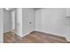 Hallway area with hardwood floors, white cabinets and white doors, creating a modern and efficient layout at 220 Mission Catalina Ln # 208, Las Vegas, NV 89107
