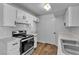 Clean kitchen features stainless steel appliances, white cabinets, and modern hardware at 220 Mission Catalina Ln # 208, Las Vegas, NV 89107