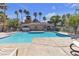 Inviting community pool with clear blue water and comfortable lounge seating under sunny skies at 220 Mission Catalina Ln # 208, Las Vegas, NV 89107