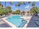 Sparkling community pool surrounded by mature palm trees is the perfect place to relax at 220 Mission Catalina Ln # 208, Las Vegas, NV 89107