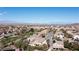Neighborhood aerial shot with mountain views and city skyline in the distance at 2279 Pacini Ct, Henderson, NV 89052