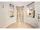 Inviting entryway with decorative wall cutouts, neutral paint, and tile flooring leads to the living areas at 2279 Pacini Ct, Henderson, NV 89052