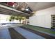 Spacious garage featuring ample storage cabinets and an overhead rack for organization at 2279 Pacini Ct, Henderson, NV 89052