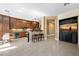 Open-concept kitchen and living area with tile floors and a breakfast bar, perfect for entertaining at 2279 Pacini Ct, Henderson, NV 89052