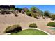 Low-maintenance backyard featuring desert landscaping, gravel, and artificial turf at 2535 Jada Dr, Henderson, NV 89044