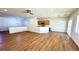 Open-concept living area featuring hardwood floors, white walls, and modern light fixtures at 2535 Jada Dr, Henderson, NV 89044