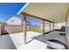 Covered patio with artificial turf, brick perimeter wall, and shade perfect for relaxation at 262 Calvino Ave, Las Vegas, NV 89183