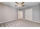 Cozy bedroom features a ceiling fan, neutral paint, plush carpet, and a double door closet at 262 Calvino Ave, Las Vegas, NV 89183
