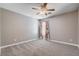 Bedroom featuring carpeted floors and window with decorative curtains at 262 Calvino Ave, Las Vegas, NV 89183