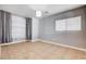 Bright bedroom featuring tiled floors, ample closet space, and a window for natural light at 262 Calvino Ave, Las Vegas, NV 89183