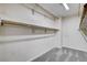 Walk-in closet with carpeted floors and rods for hanging clothes at 262 Calvino Ave, Las Vegas, NV 89183