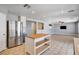 Bright open kitchen with stainless appliances, island, and access to the living room space at 262 Calvino Ave, Las Vegas, NV 89183