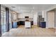 Open kitchen with stainless appliances, granite counters, and tile flooring throughout at 262 Calvino Ave, Las Vegas, NV 89183