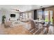 Cozy staged living area with a dining table, sofa, chairs, and access to backyard at 262 Calvino Ave, Las Vegas, NV 89183