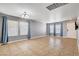 Well-lit living room with tile floor, neutral paint, and large window at 262 Calvino Ave, Las Vegas, NV 89183