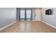A bright living room has tile flooring, light gray walls, and natural lighting at 262 Calvino Ave, Las Vegas, NV 89183