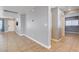 Inviting living room with neutral paint, tile flooring, and a bright white front door entrance at 262 Calvino Ave, Las Vegas, NV 89183