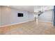 Clean, empty living room with tile flooring and neutral paint at 262 Calvino Ave, Las Vegas, NV 89183