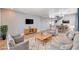 Bright living room with tile floors, plush seating, and an open dining area at 262 Calvino Ave, Las Vegas, NV 89183