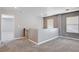 Upstairs loft featuring neutral paint, carpeting, and view to adjoining room at 262 Calvino Ave, Las Vegas, NV 89183
