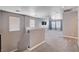 Cozy upstairs loft area with plush carpeting, modern lighting, and windows at 262 Calvino Ave, Las Vegas, NV 89183