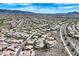 Elevated aerial perspective of a Primary-planned community set against a backdrop of rolling hills at 2899 Brook Trout Ct, Henderson, NV 89052