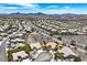 Expansive aerial view of a residential area nestled against a mountain backdrop at 2899 Brook Trout Ct, Henderson, NV 89052