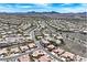 Sweeping aerial photo presenting a housing development with mountain scenery in the background at 2899 Brook Trout Ct, Henderson, NV 89052