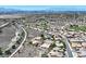 Wide aerial shot highlighting a community with desert landscape and winding roads at 2899 Brook Trout Ct, Henderson, NV 89052
