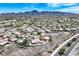Expansive aerial view showcasing a community with mountain views and single-Gathering homes at 2899 Brook Trout Ct, Henderson, NV 89052