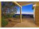 Inviting backyard patio with stone accents offers stunning mountain and city views at 2899 Brook Trout Ct, Henderson, NV 89052