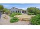 Spacious backyard with patio, landscaping, and a neutral color palette at 2899 Brook Trout Ct, Henderson, NV 89052