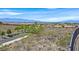 Backyard view featuring desert landscape and neighboring properties at 2899 Brook Trout Ct, Henderson, NV 89052