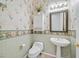 Powder room features patterned wallpaper, pedestal sink, and tile floor at 2899 Brook Trout Ct, Henderson, NV 89052