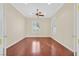 Bright, airy bedroom boasts hardwood floors, ceiling fan, and plantation shutters at 2899 Brook Trout Ct, Henderson, NV 89052